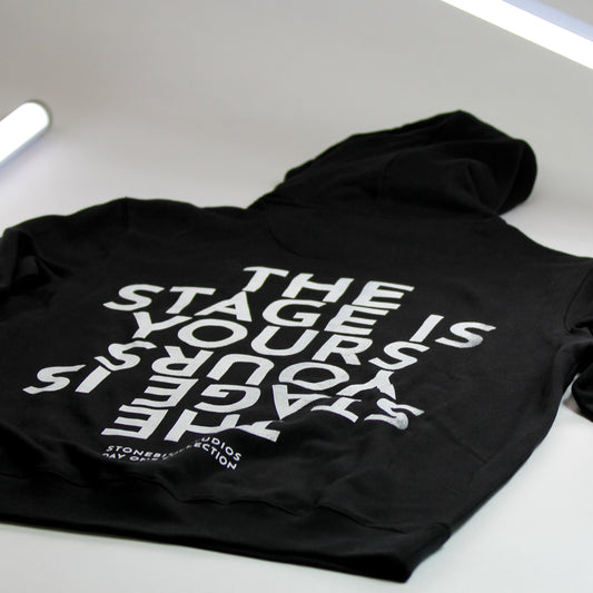 Stonebite Merch Hoodie in black with white print saying the stage is yours
